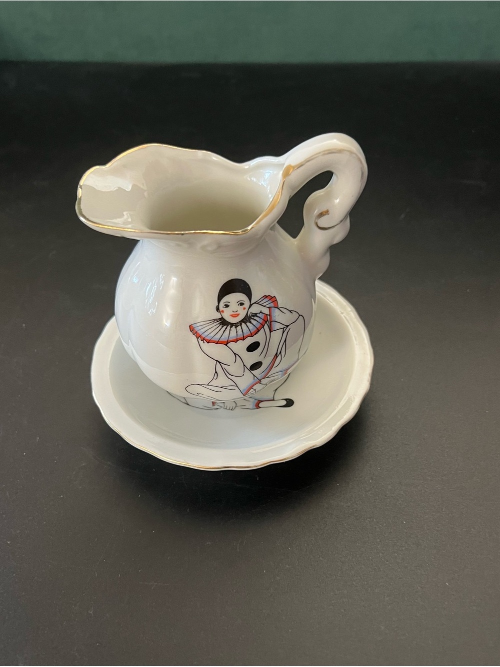 White Porcelain Clown Pitcher and Saucer with Gold Trim
